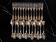 24 silver-plated metal table settings in the filet model.
