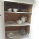 Small vintage piece of furniture sublimated in a linen shade, wooden top.