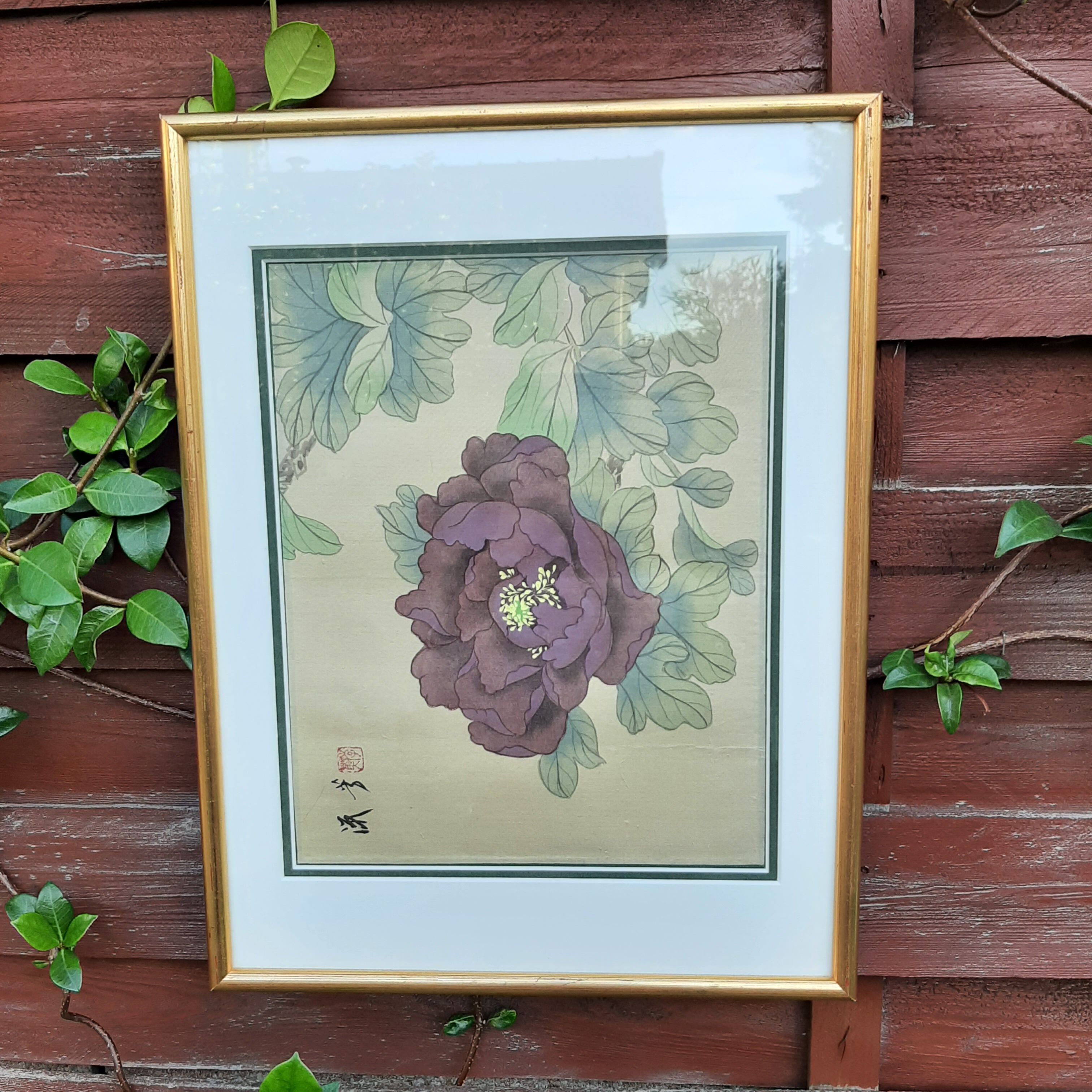 Chinese print purple flower under golden frame