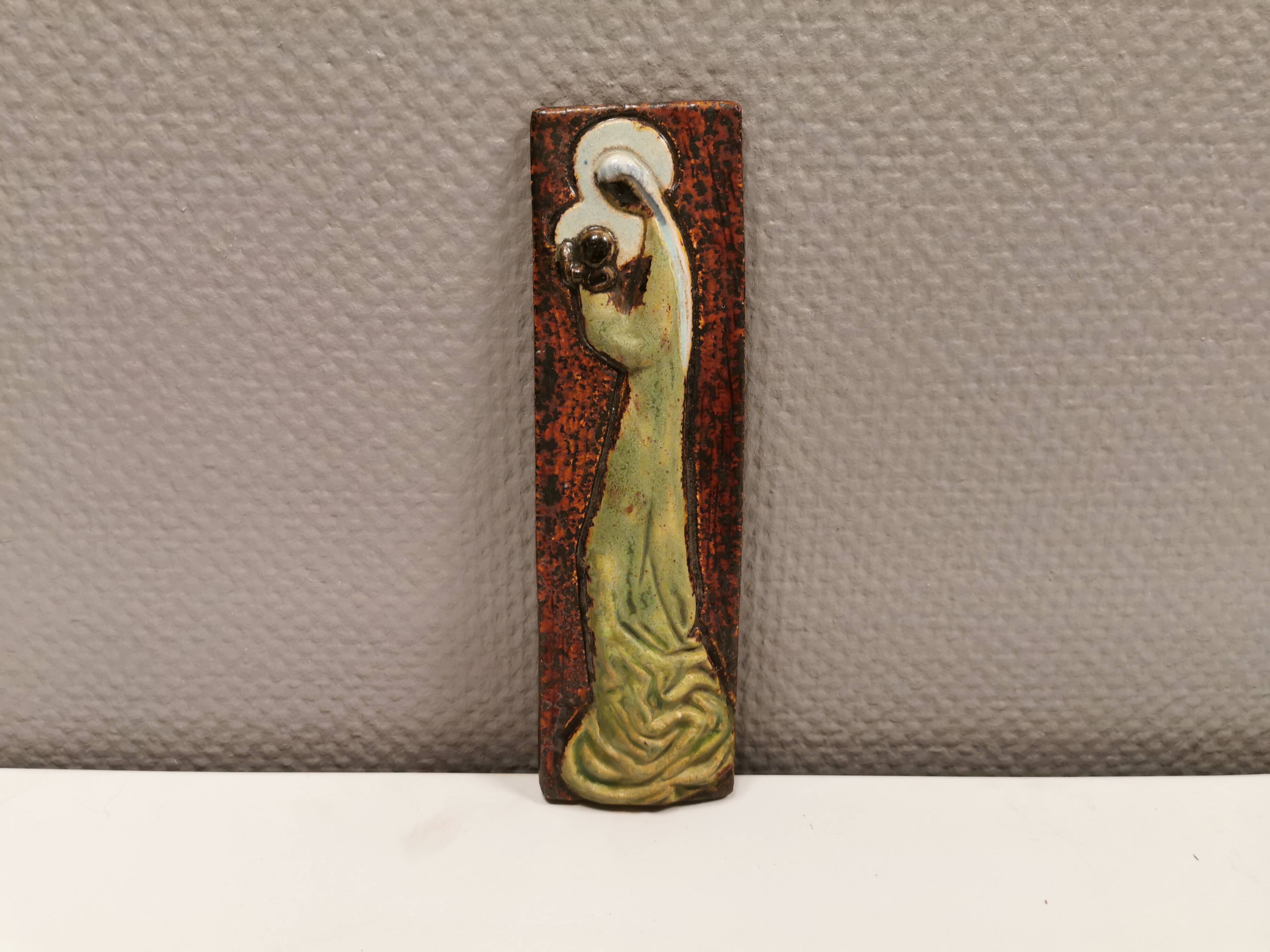 Slim relief with a motif of Madonna and child.