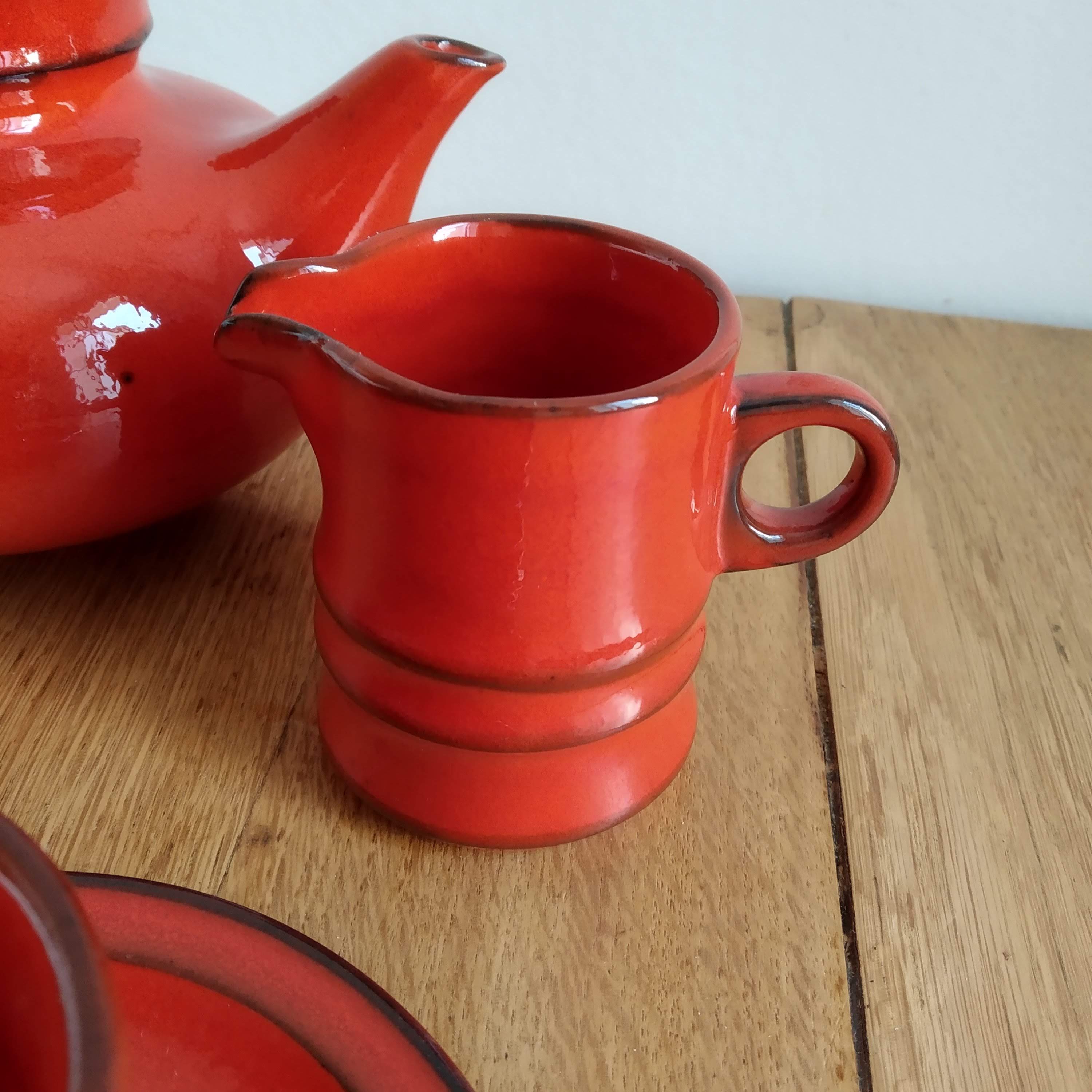 Red ceramic tea service