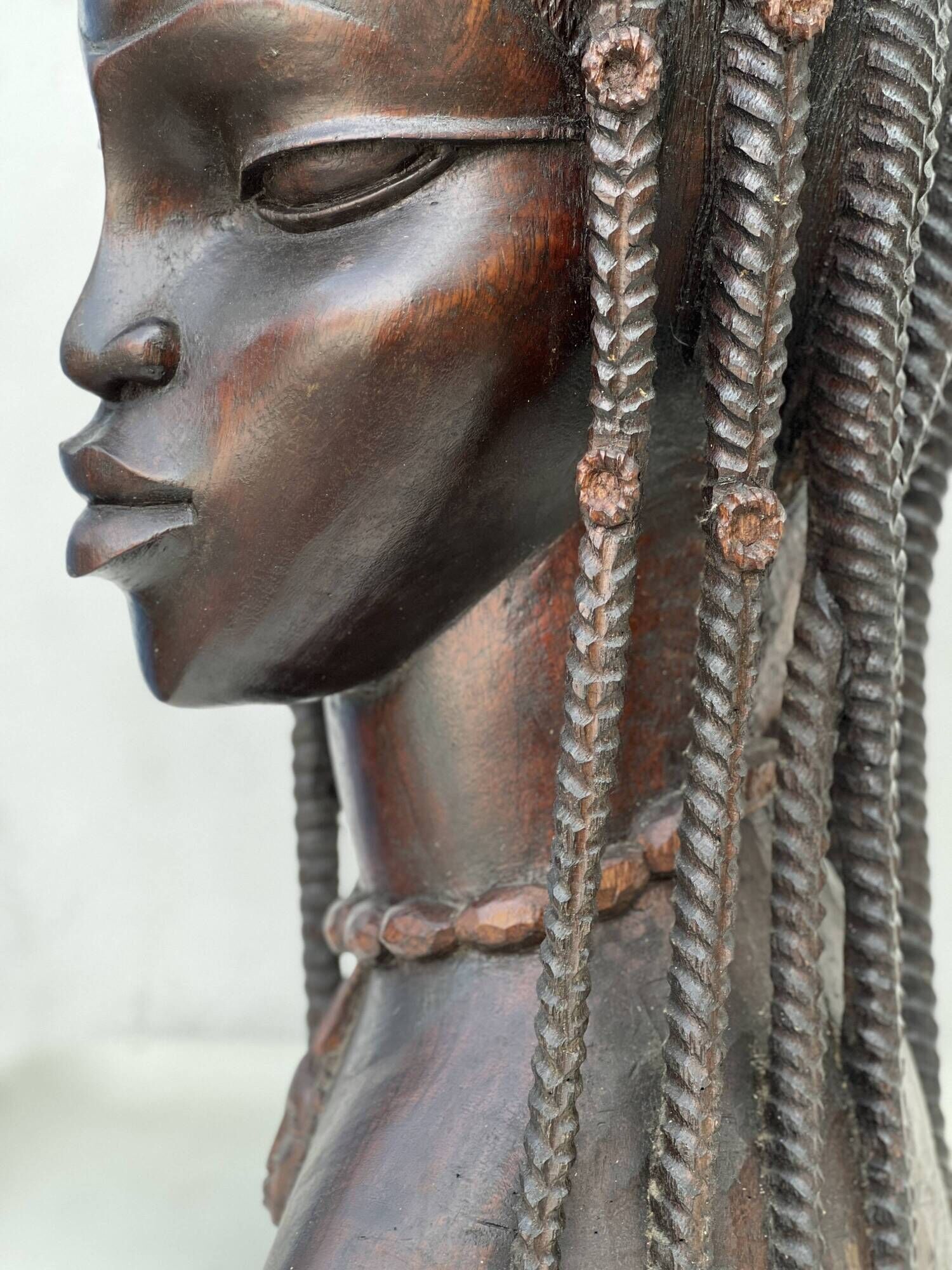 Large wooden bust of an African woman.