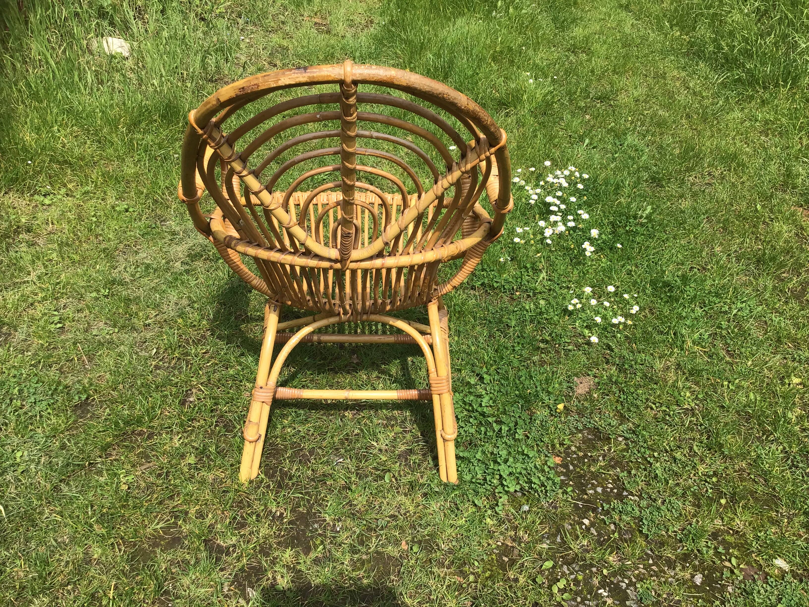 Vintage ovoid-shaped rattan armchair.