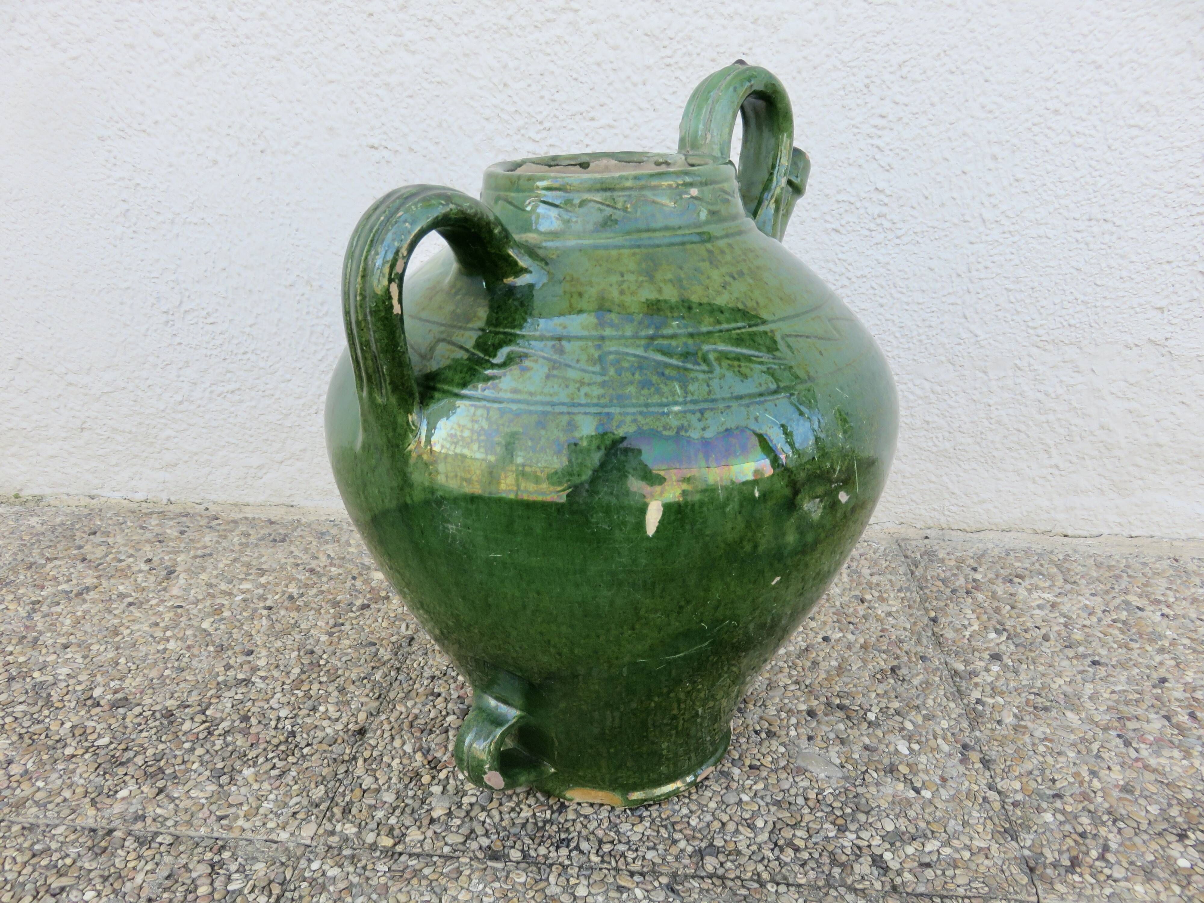Antique glazed green terracotta oil jar, late 19th century.