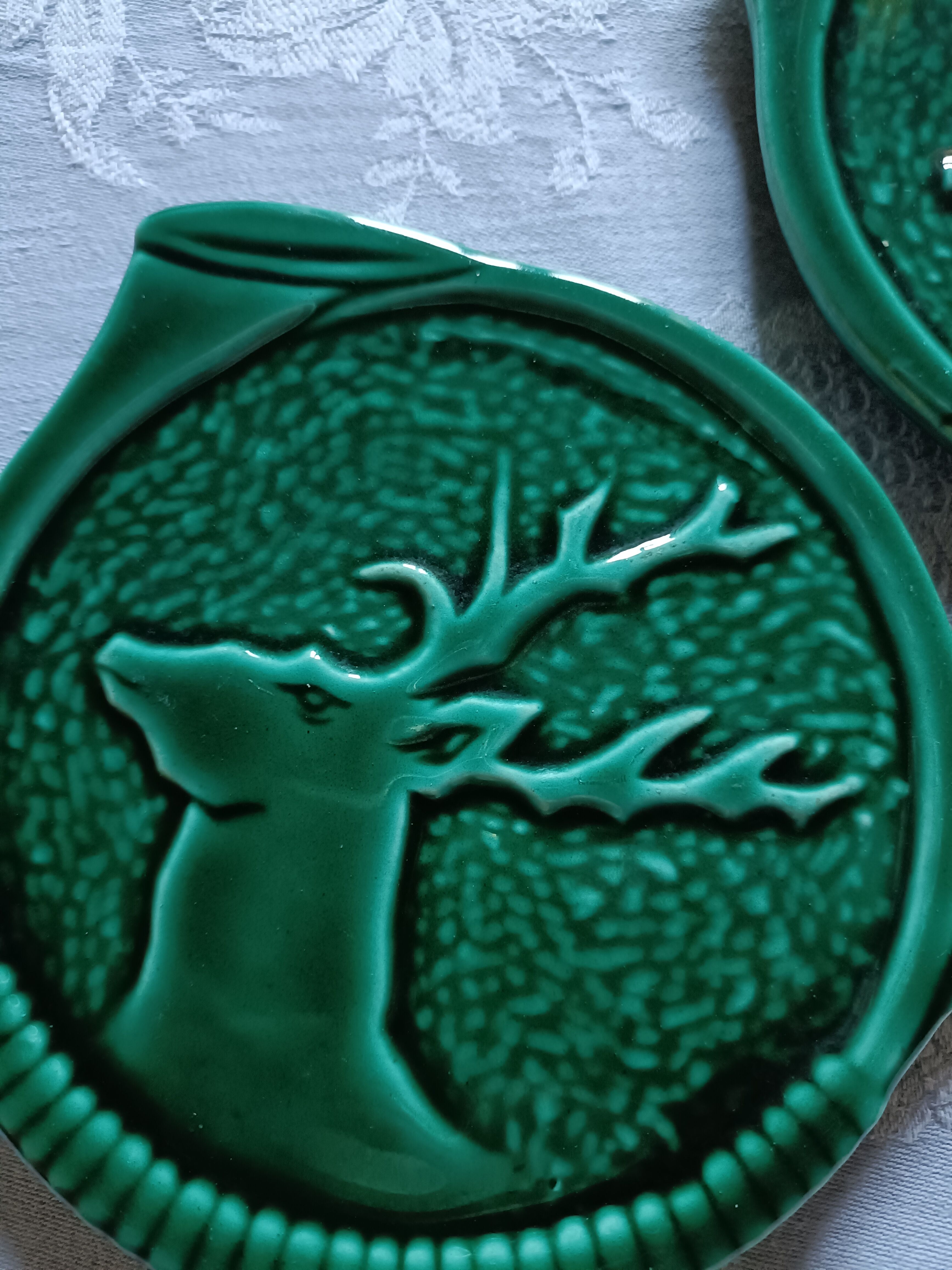 Green barbotine bottle coasters from Vallauris