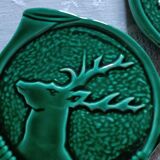 Green barbotine bottle coasters from Vallauris
