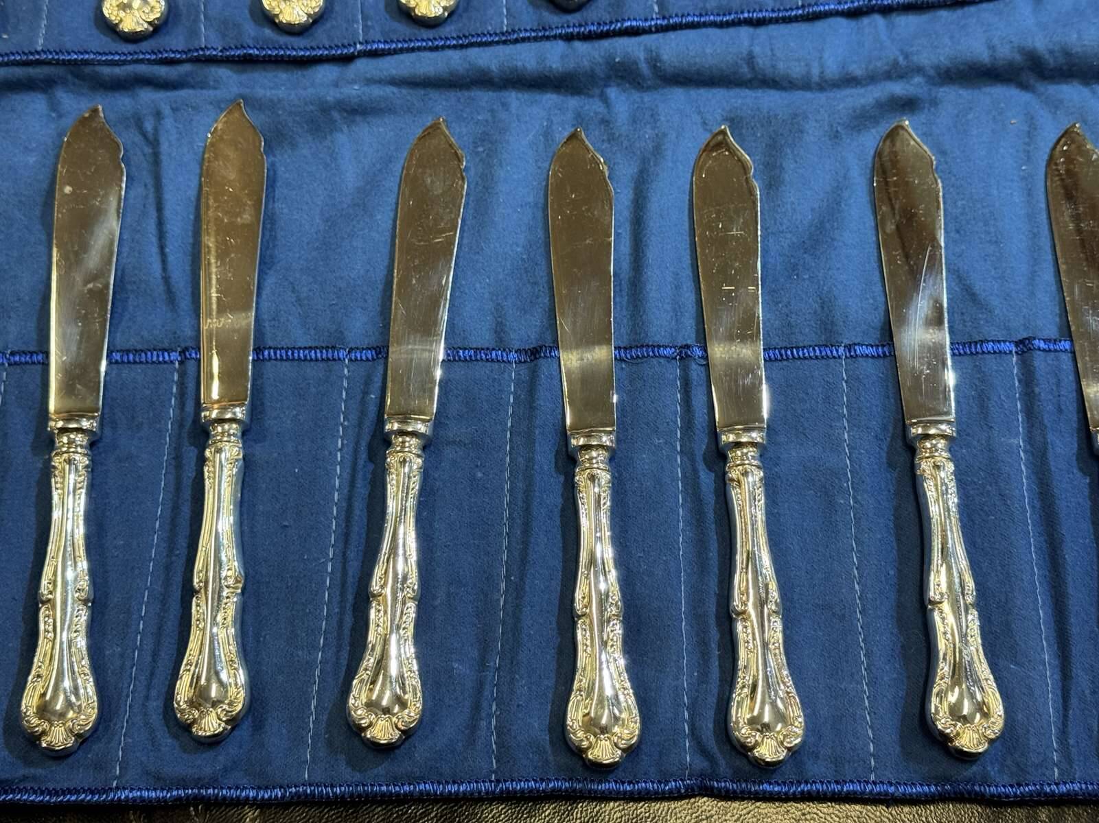 Service of 12 fish knives and 12 fish forks by Mappin and Webb.