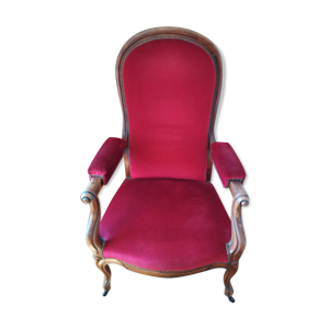 Fauteuil d'époque avec son repose