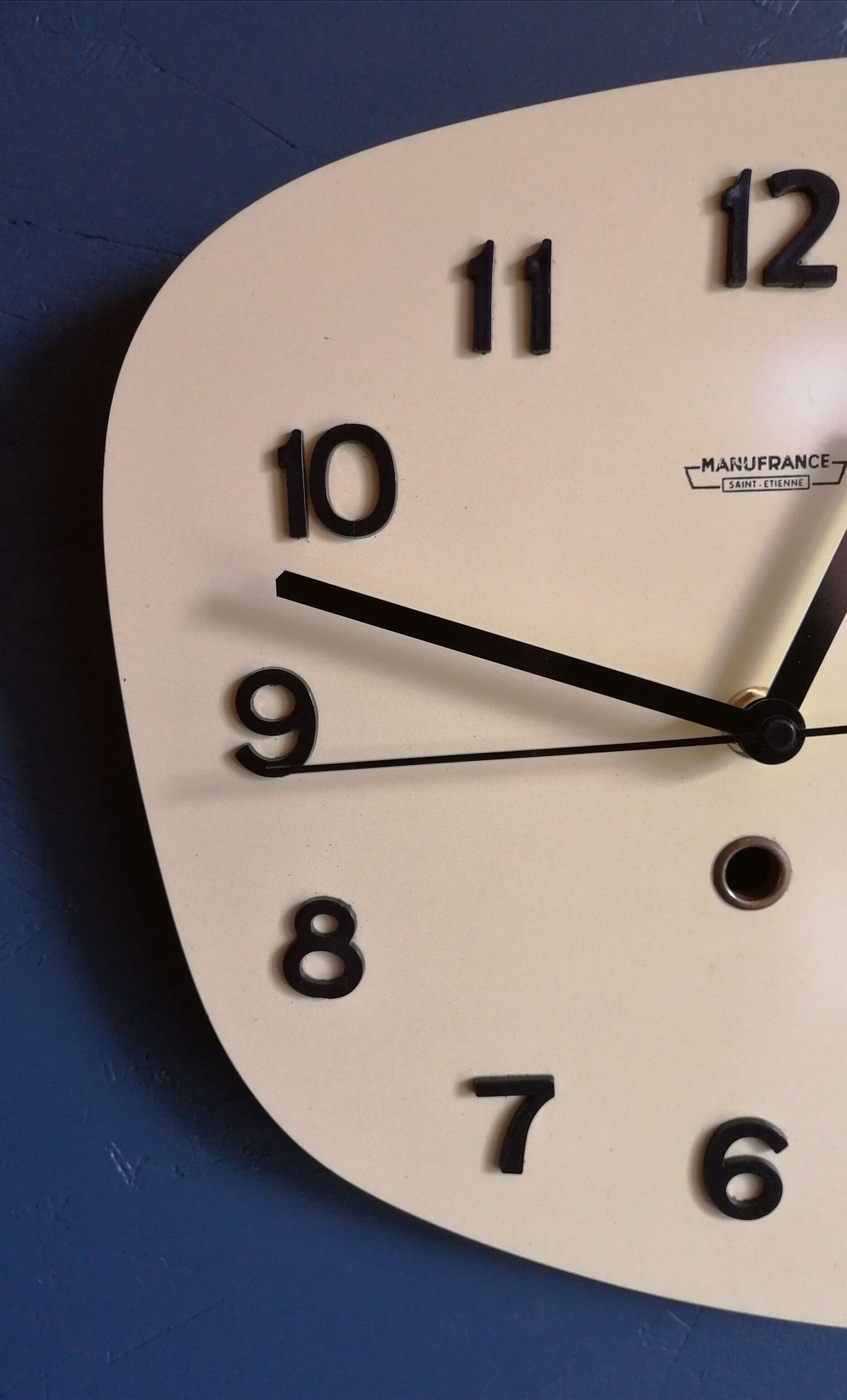 Clock formica vintage asymmetrical silent wall clock "Manufrance pale yellow"