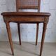 Art Deco caned chair with bronze ornaments.