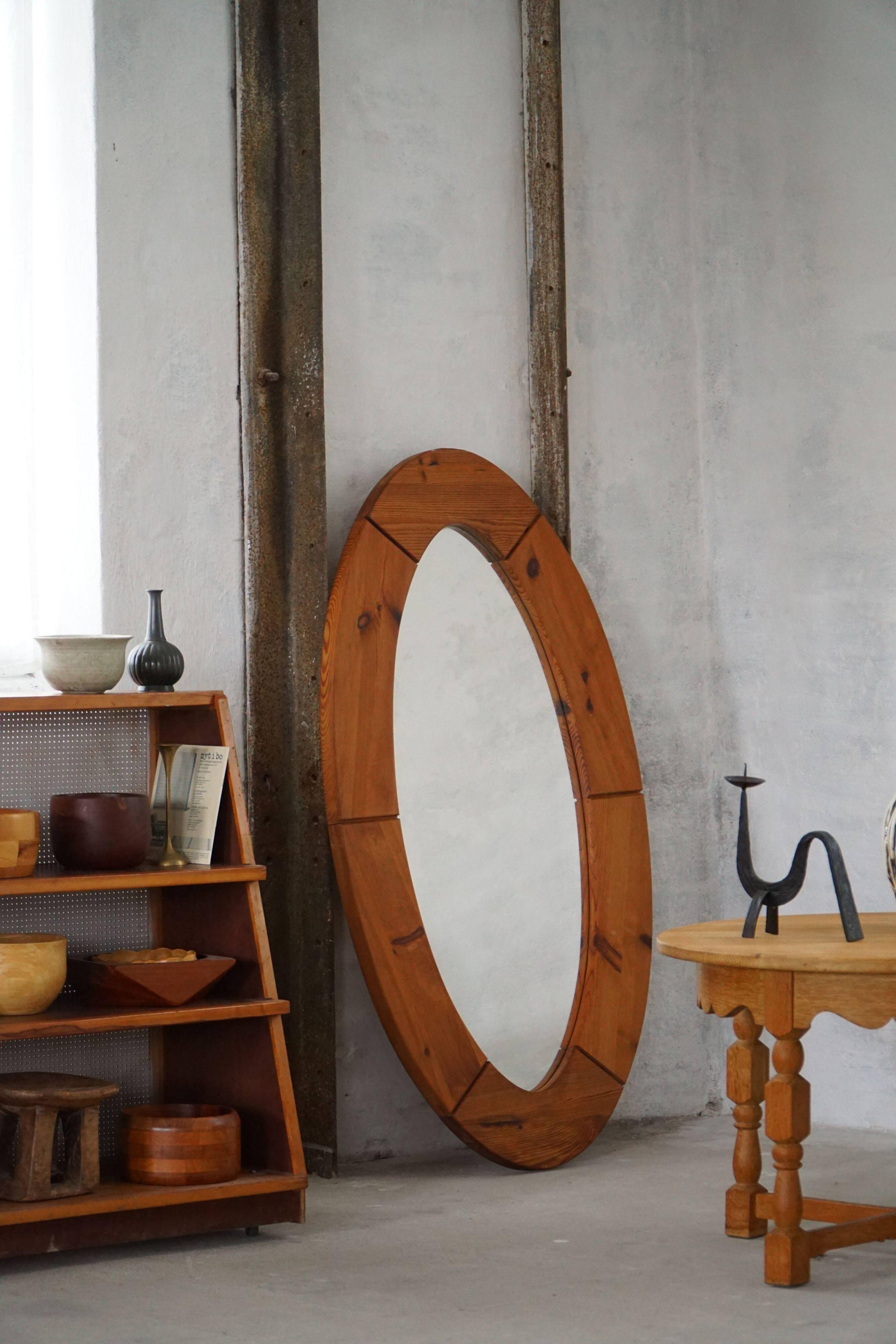 Large oval wall mirror in solid pine by Glasmäster Markaryd, Sweden, 1960s.