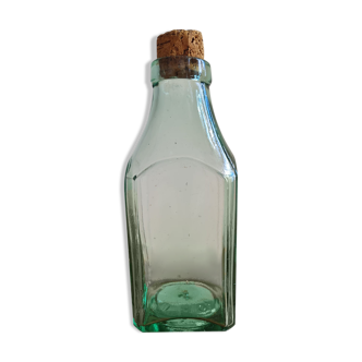 Green blown glass bottle