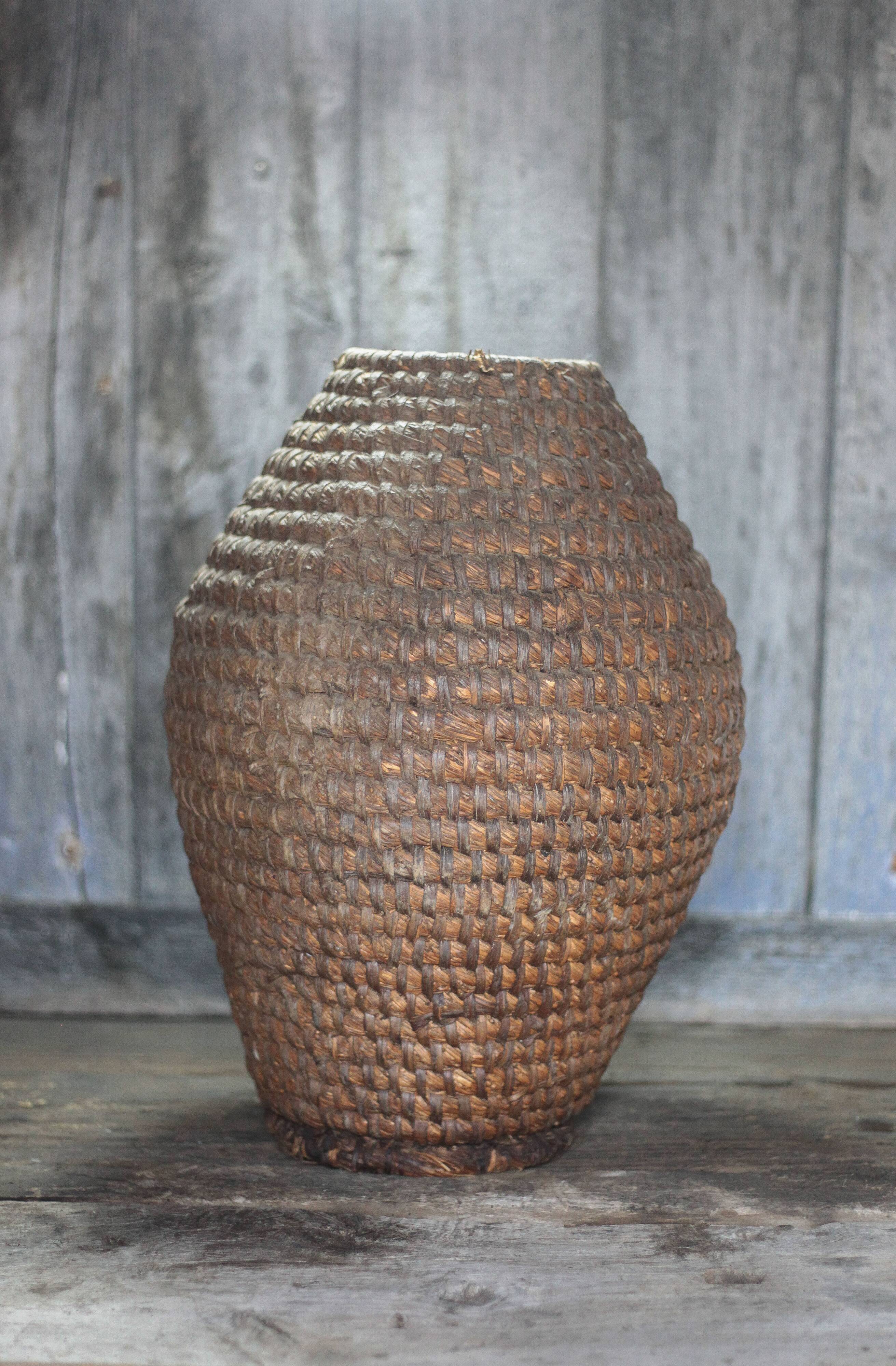 Old basket, straw and bramble bourgne, woven basket, interior decoration.