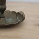 Antique hand candlestick in patinated brass – Vintage cellar rat