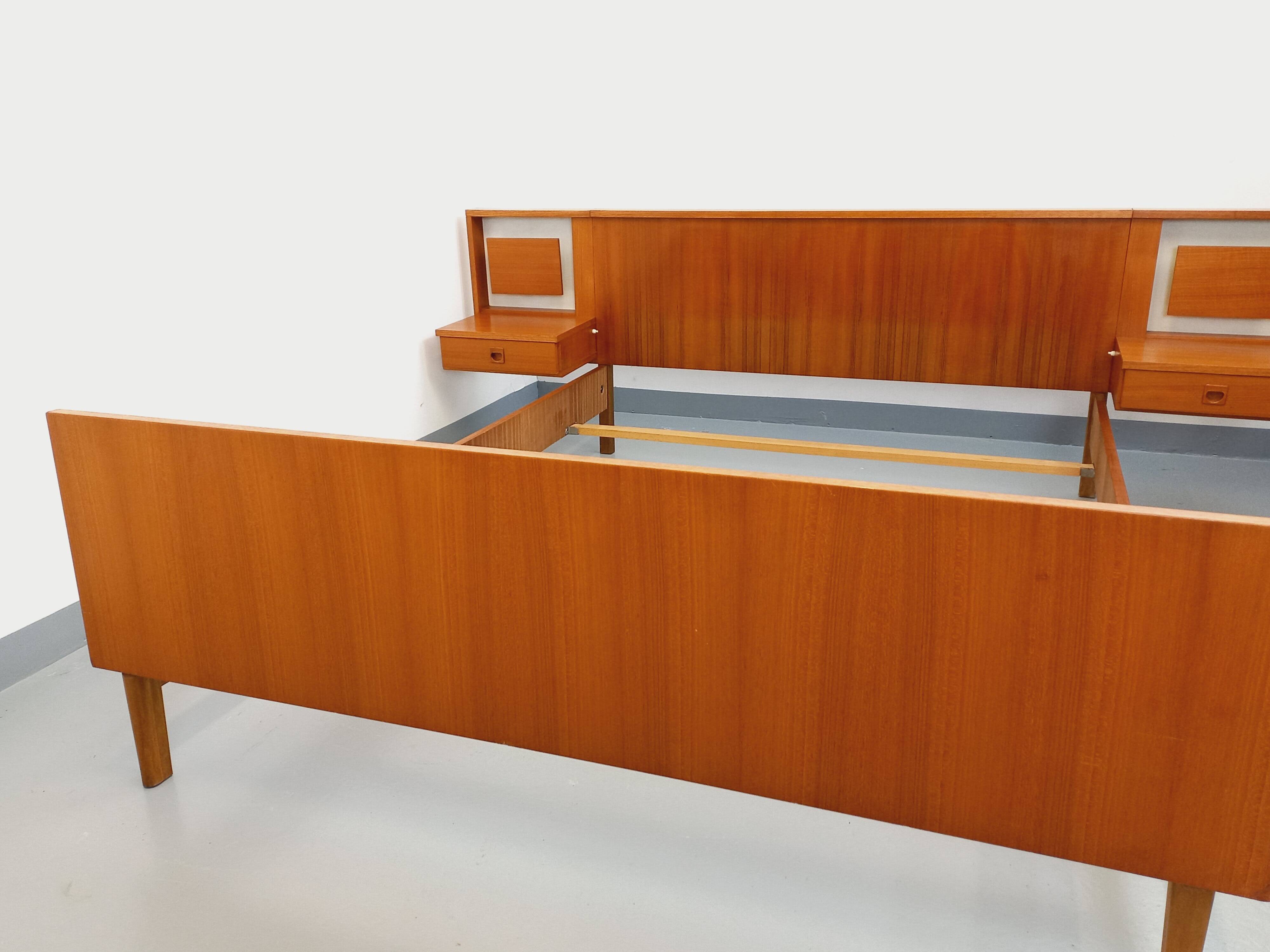 Vintage Scandinavian style double bed in teak from the 60s with integrated bedside lights