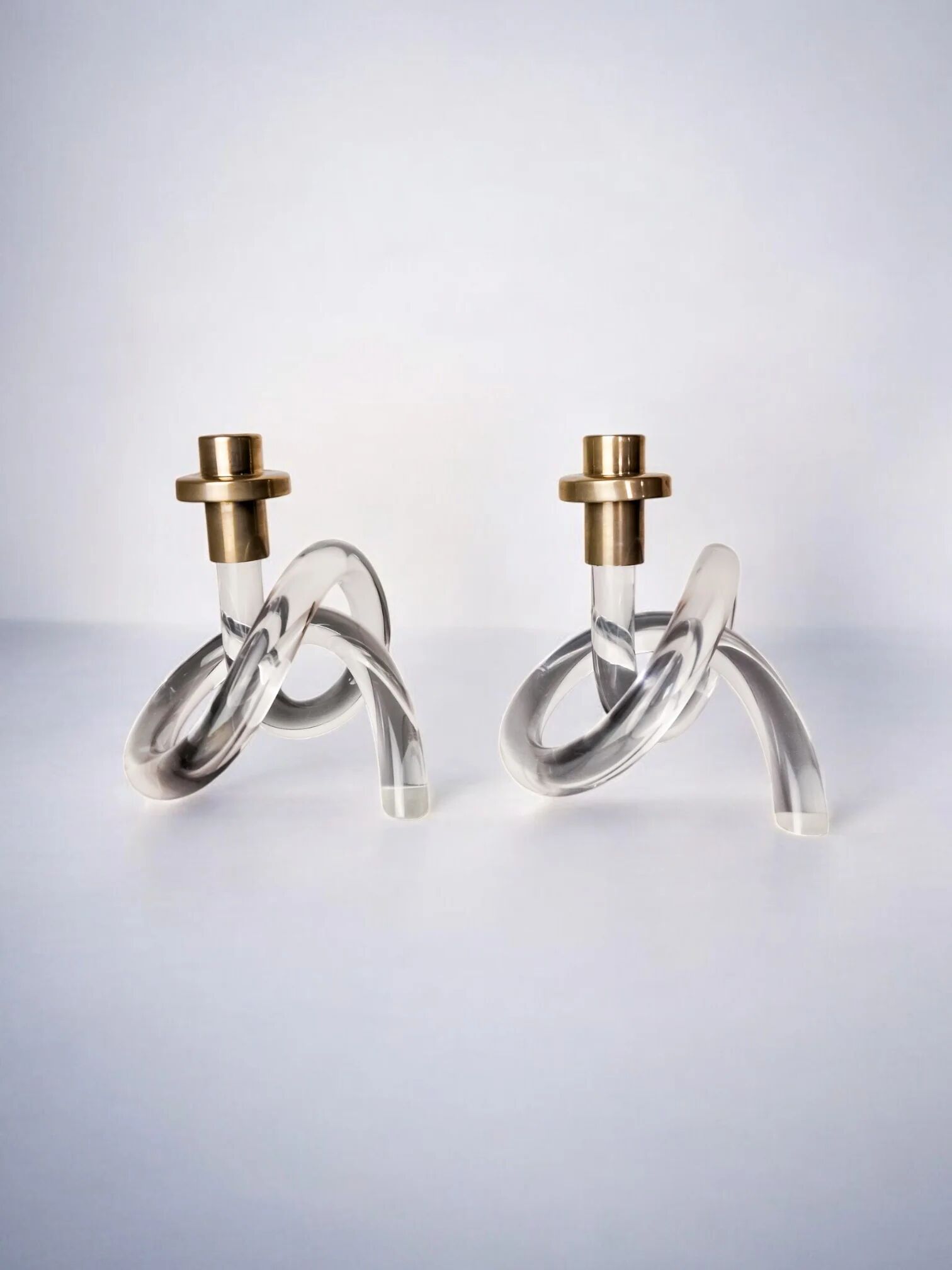 Pair of pretzel candlesticks by Dorothy Thorpe, Lucite and gilt brass, 1970s