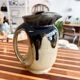 Antique carafe in flamed enamelled ceramic