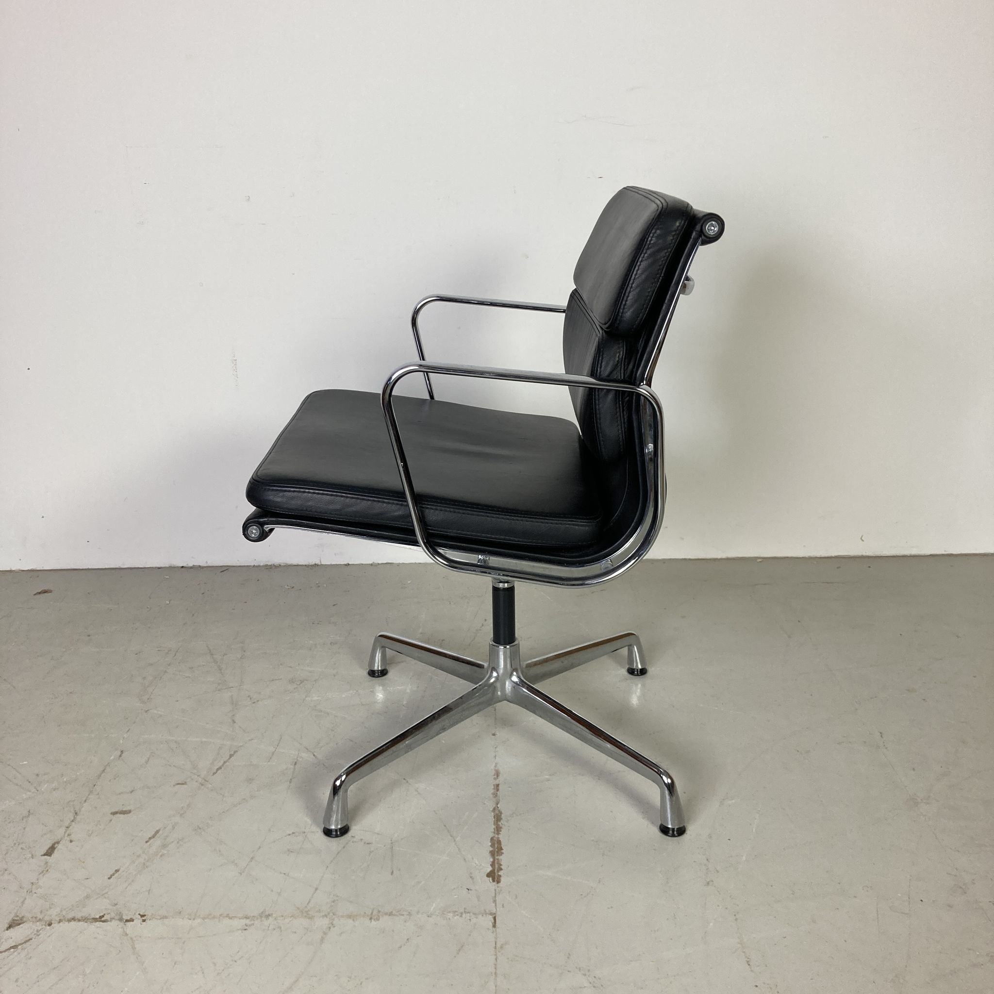 Eames black leather Soft Pad Group chair made by Vitra for Herman Miller