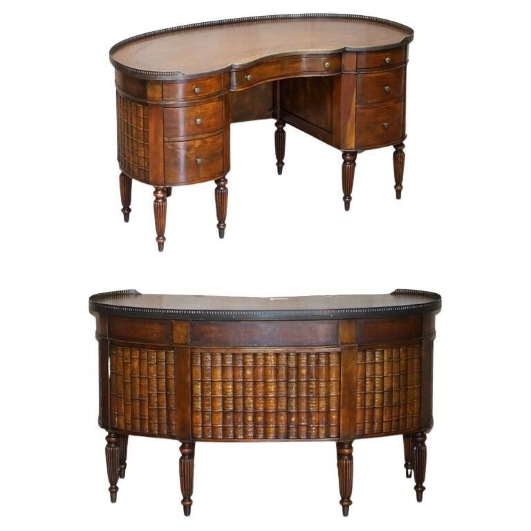Regency style hardwood and leather kidney desk with gallery.