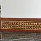 Console topped with an Empire-style mirror.