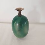 Green pot-bellied ceramic vase with foot and high, narrow neck in signed raku