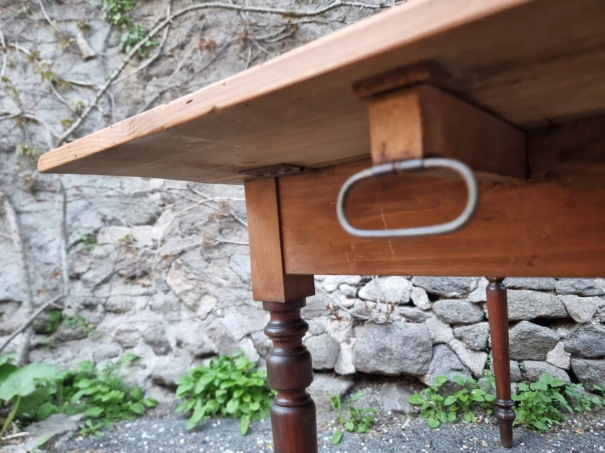 Vintage pine table with drop-leaf extension and turned beech legs, France, 1930s.