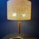 Elegant table lamp with a slender teak body on a tripod brass base, Germany, 1960s.