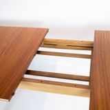 Dining table in teak and oak with extensions designed by Hans J. Wegner