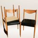 Set of 6 modernist chairs with black faux leather seats.