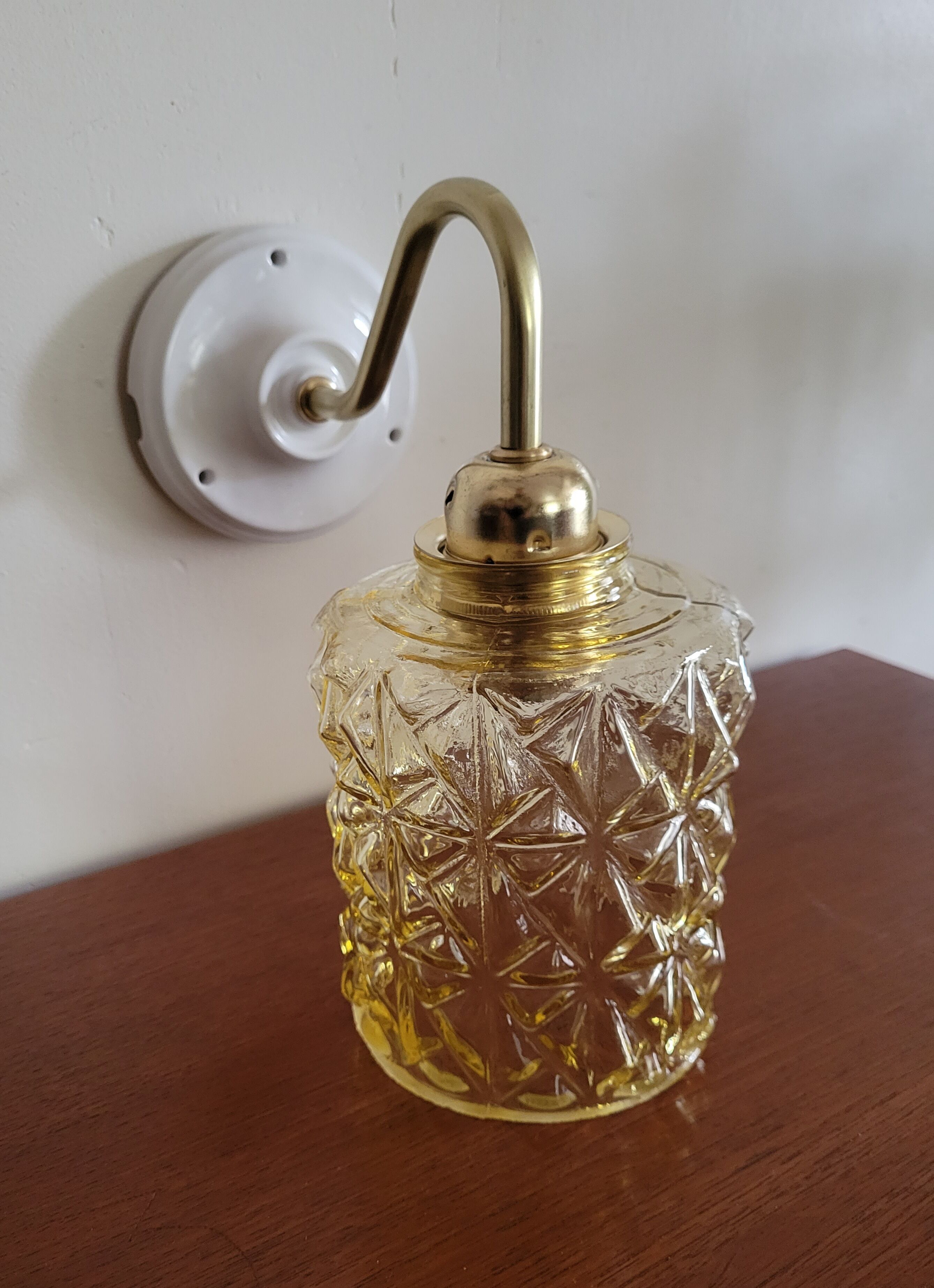 Brass wall lamp and molded glass