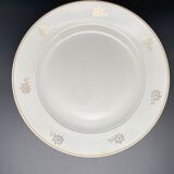 Round serving dish with small flower pattern and silver border