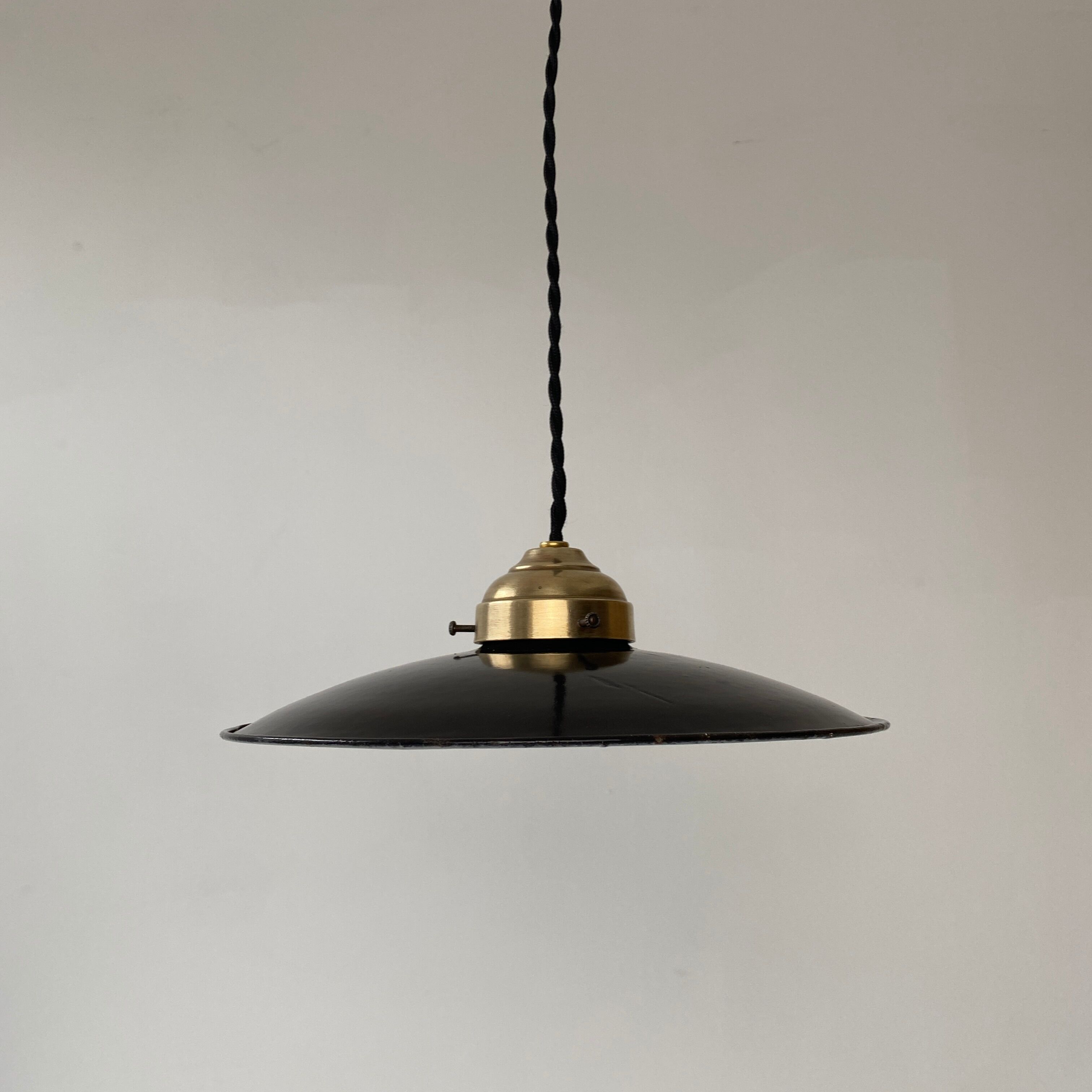 Old black enamelled industrial suspension