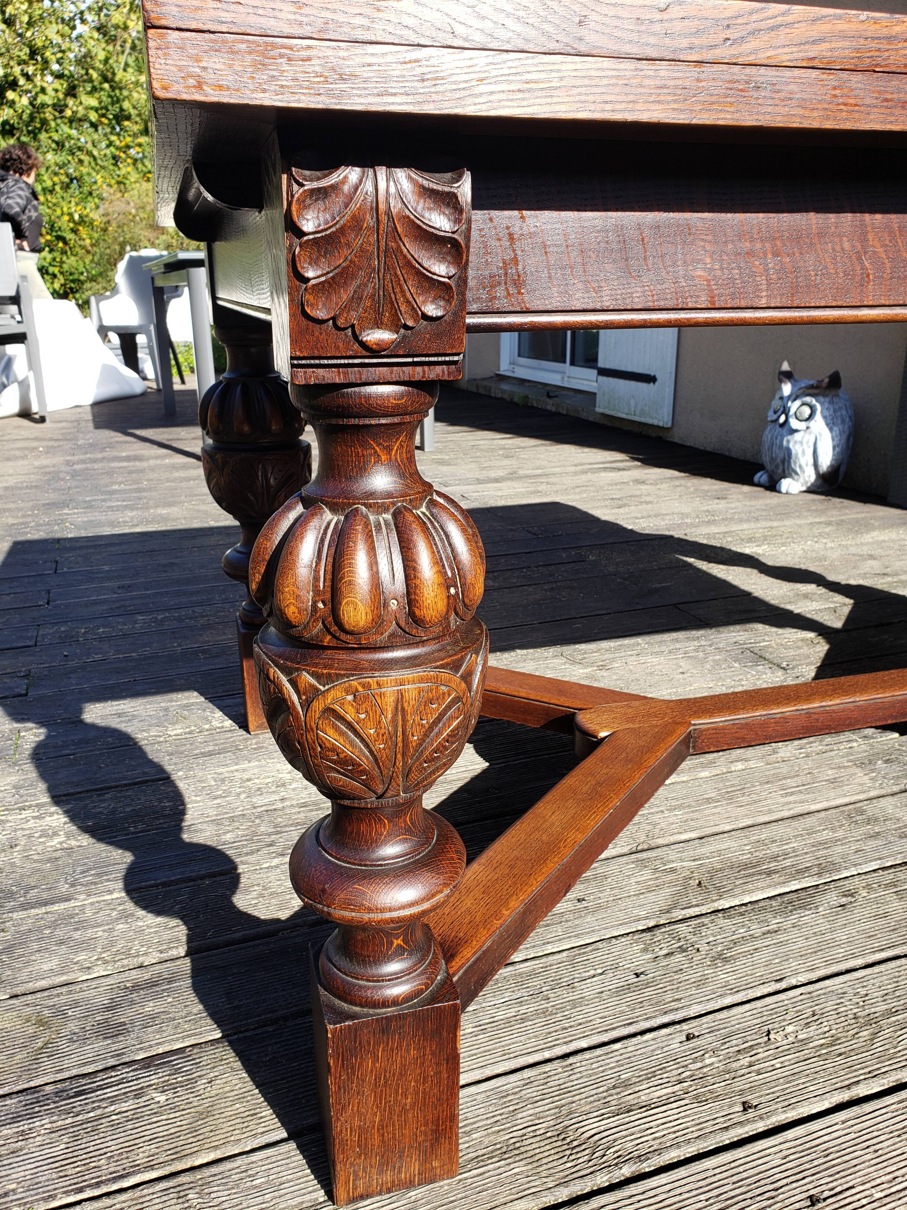 1910s Jacobean style solid oak extending drawer dining table