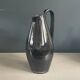 Black glazed ceramic pitcher signed M Azouit