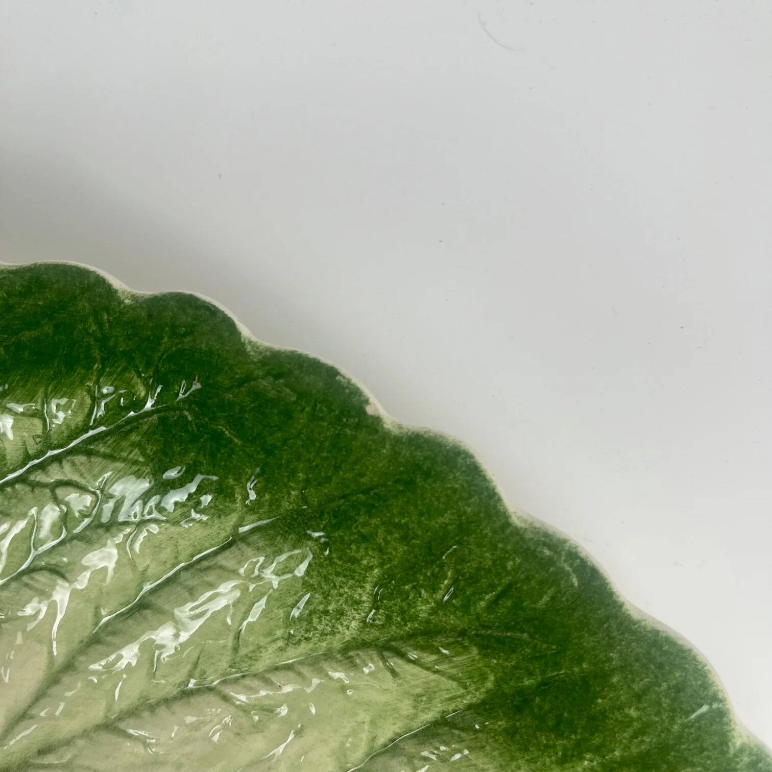 Leaf and strawberry-shaped bowl/strainer.