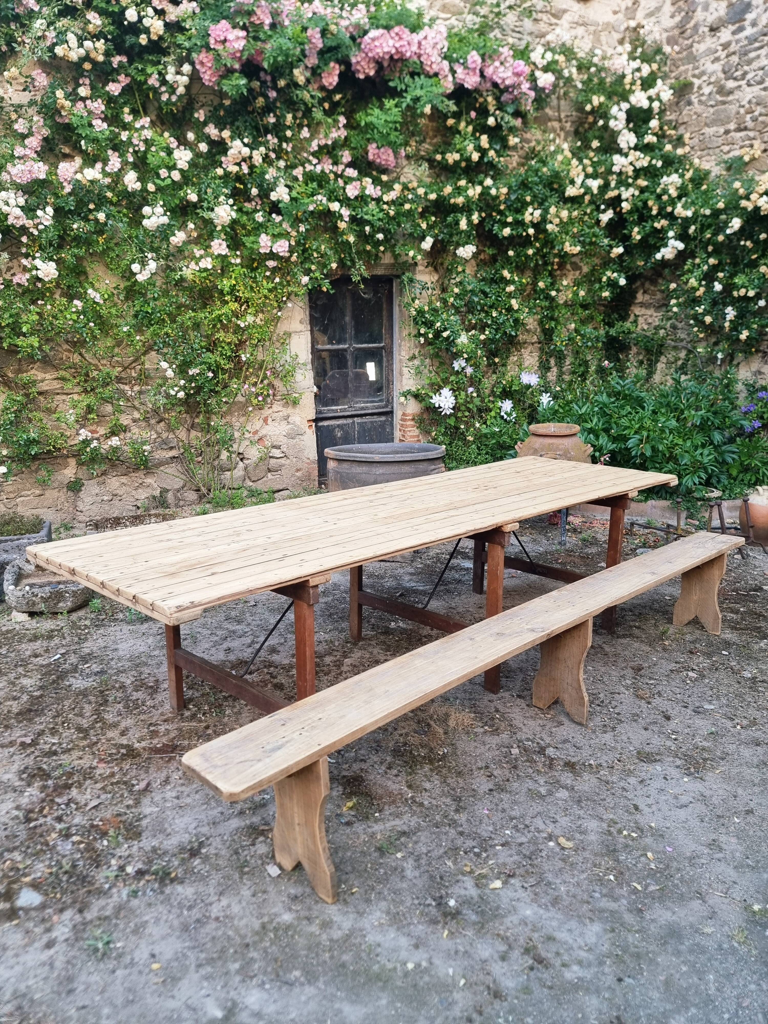 Antique French folding garden table set with benches, pine and chestnut, circa 1900–1920.