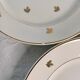 11 plates in antique earthenware decorated with golden leaves and golden border