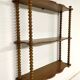 Vintage turned wood wall shelf with 3 levels.