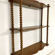 Vintage turned wood wall shelf with 3 levels.