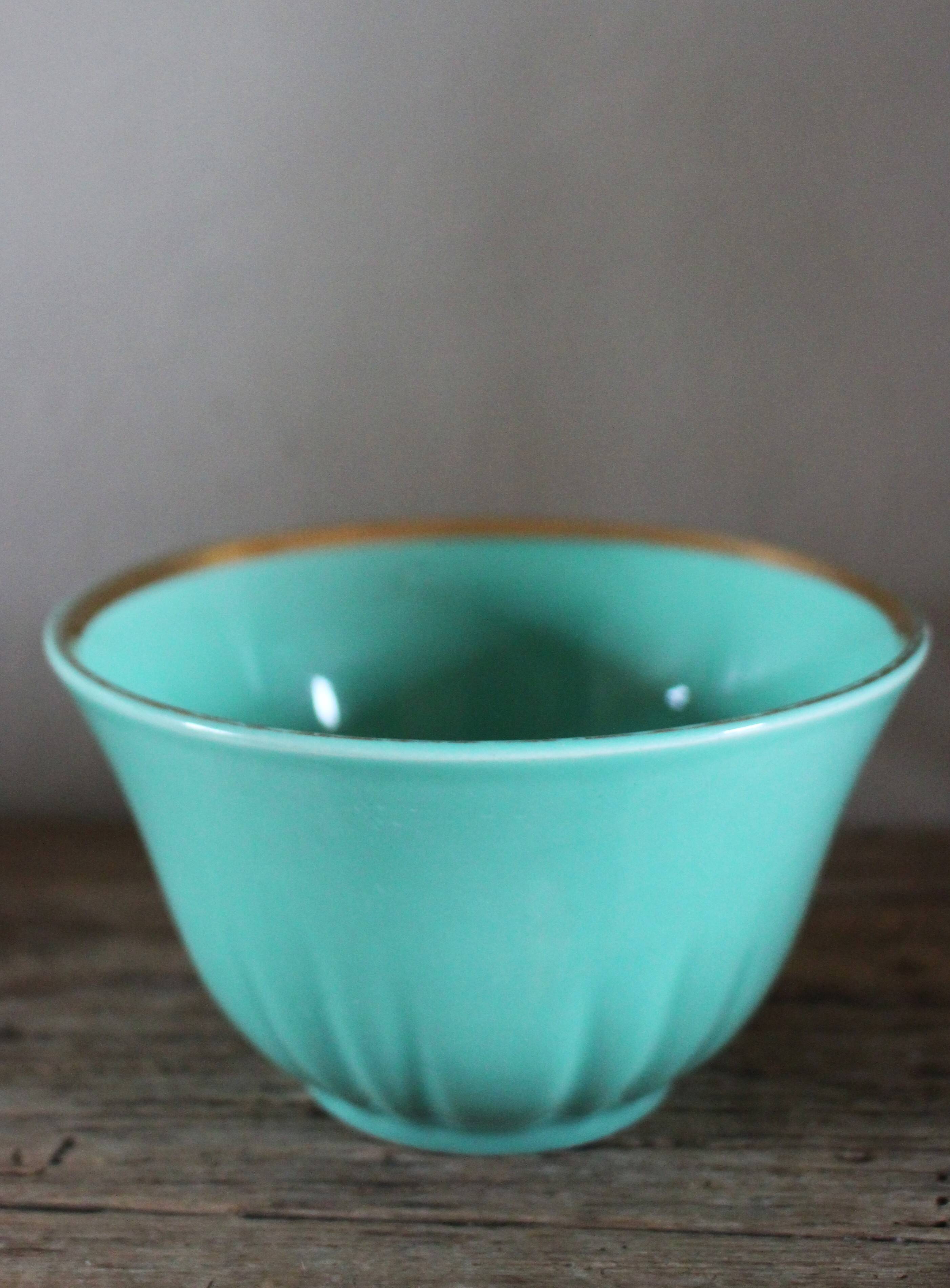 Green and gold cup from the Moi Salins collection.