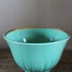 Green and gold cup from the Moi Salins collection.