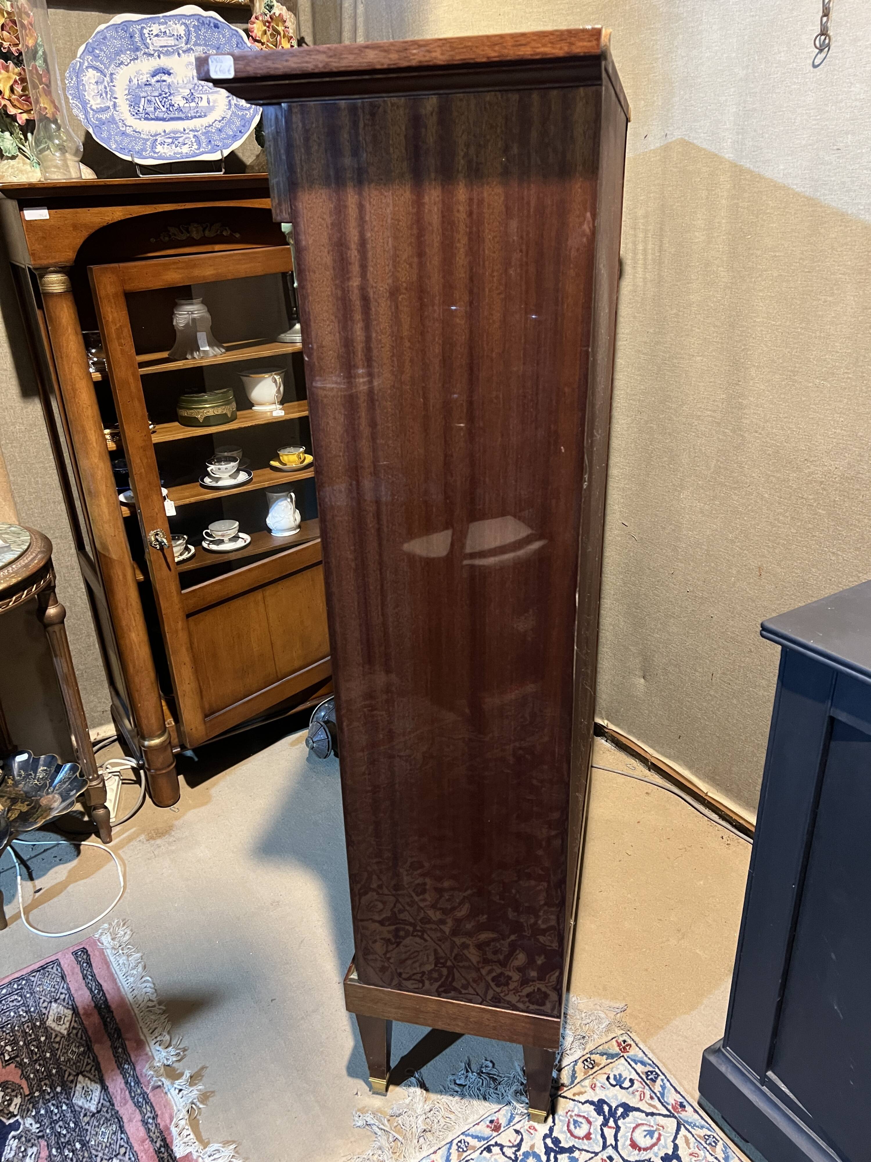 Directoire style bookcase in mahogany, decorated with gilded bronze.