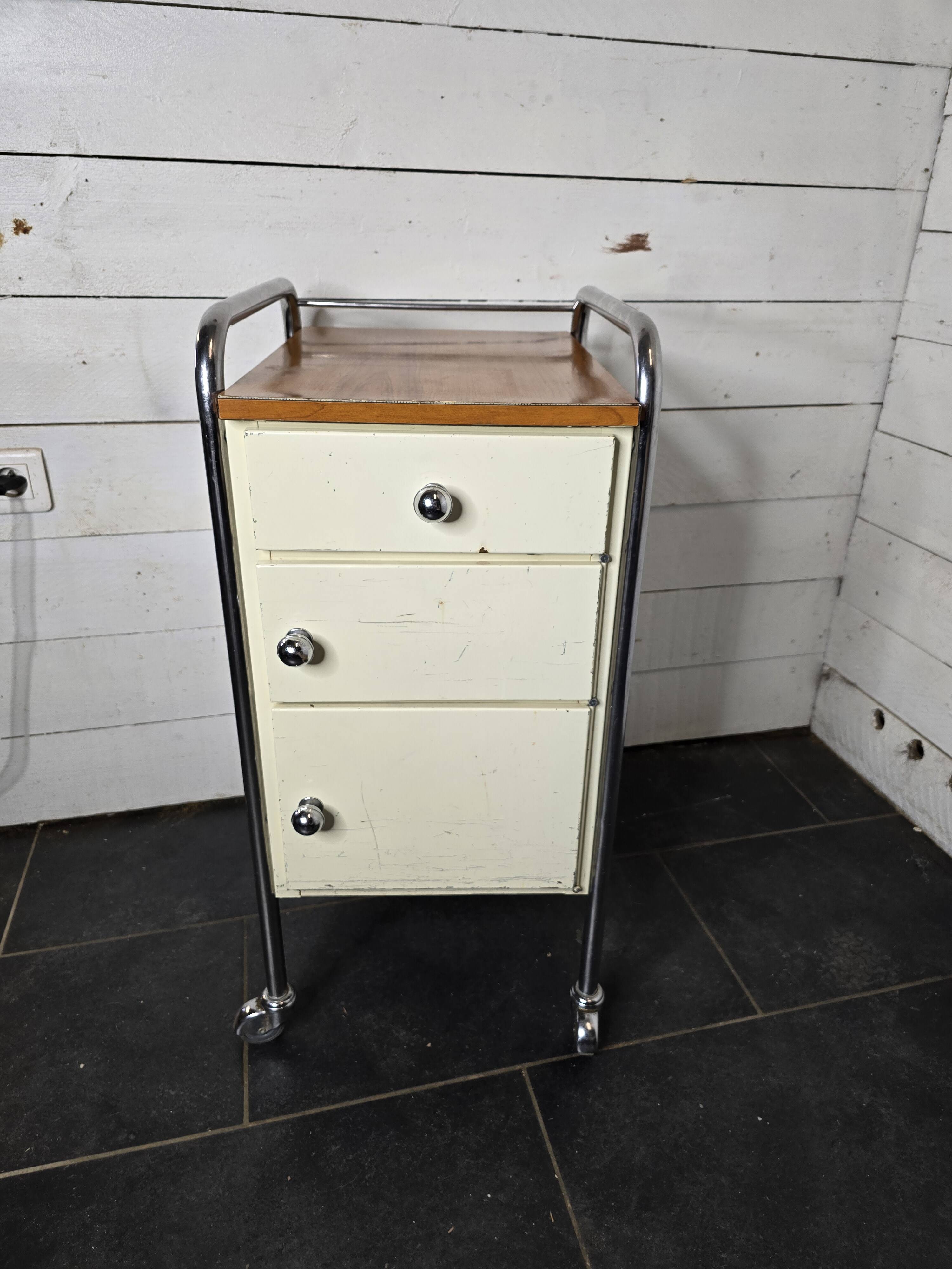 Mid-20th century metal cabinet table on wheels