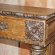 Antique fireplace from around 1880 in solid hand-carved elm with openwork columns.
