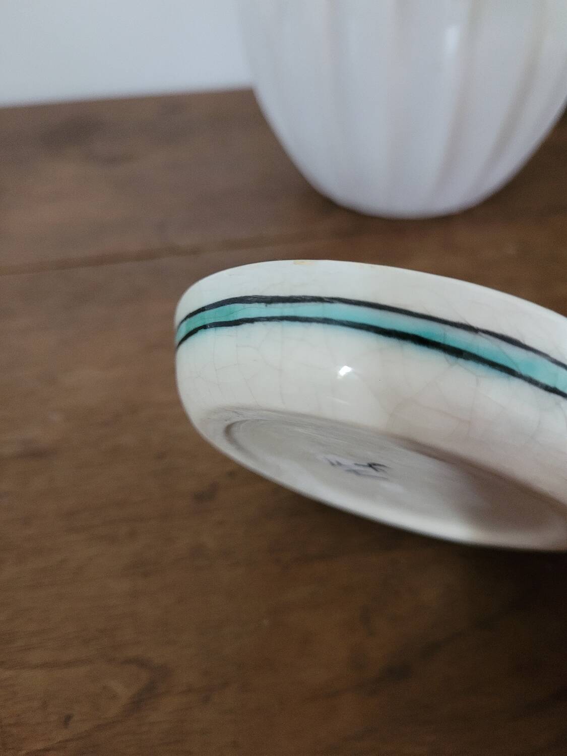 Small glazed stoneware bowl with a fish design