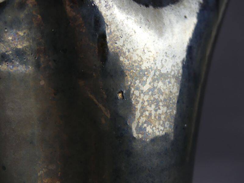 Old Biot, modernist pitcher in iridescent black ceramic.