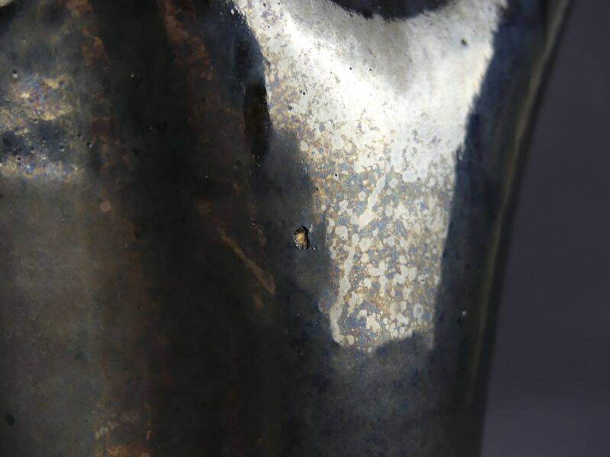 Old Biot, modernist pitcher in iridescent black ceramic.