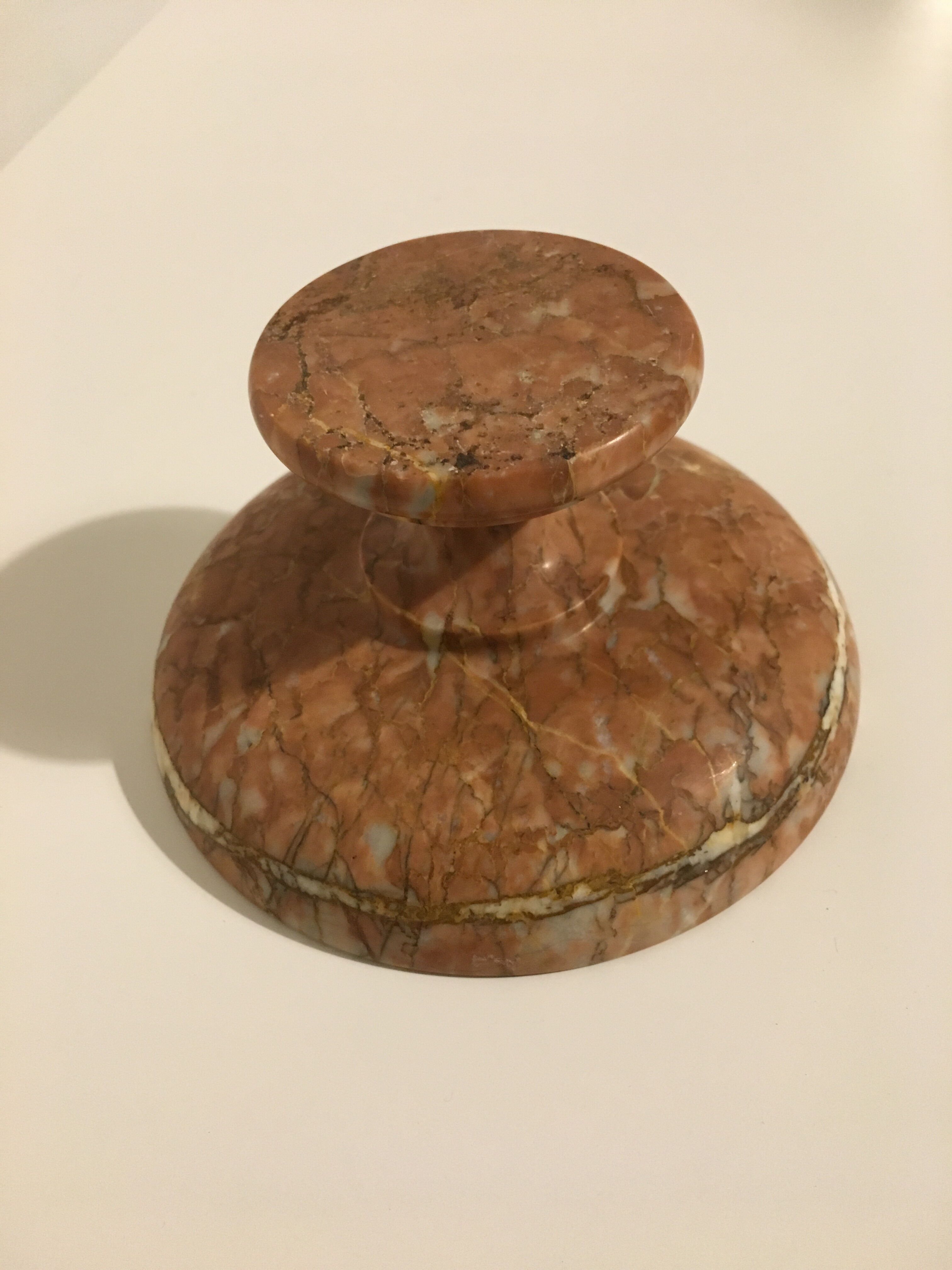 Empty pocket on foot in red marble