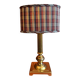 Lamp base in gilded brass, oval silk lampshade with a checkered pattern in burgundy.