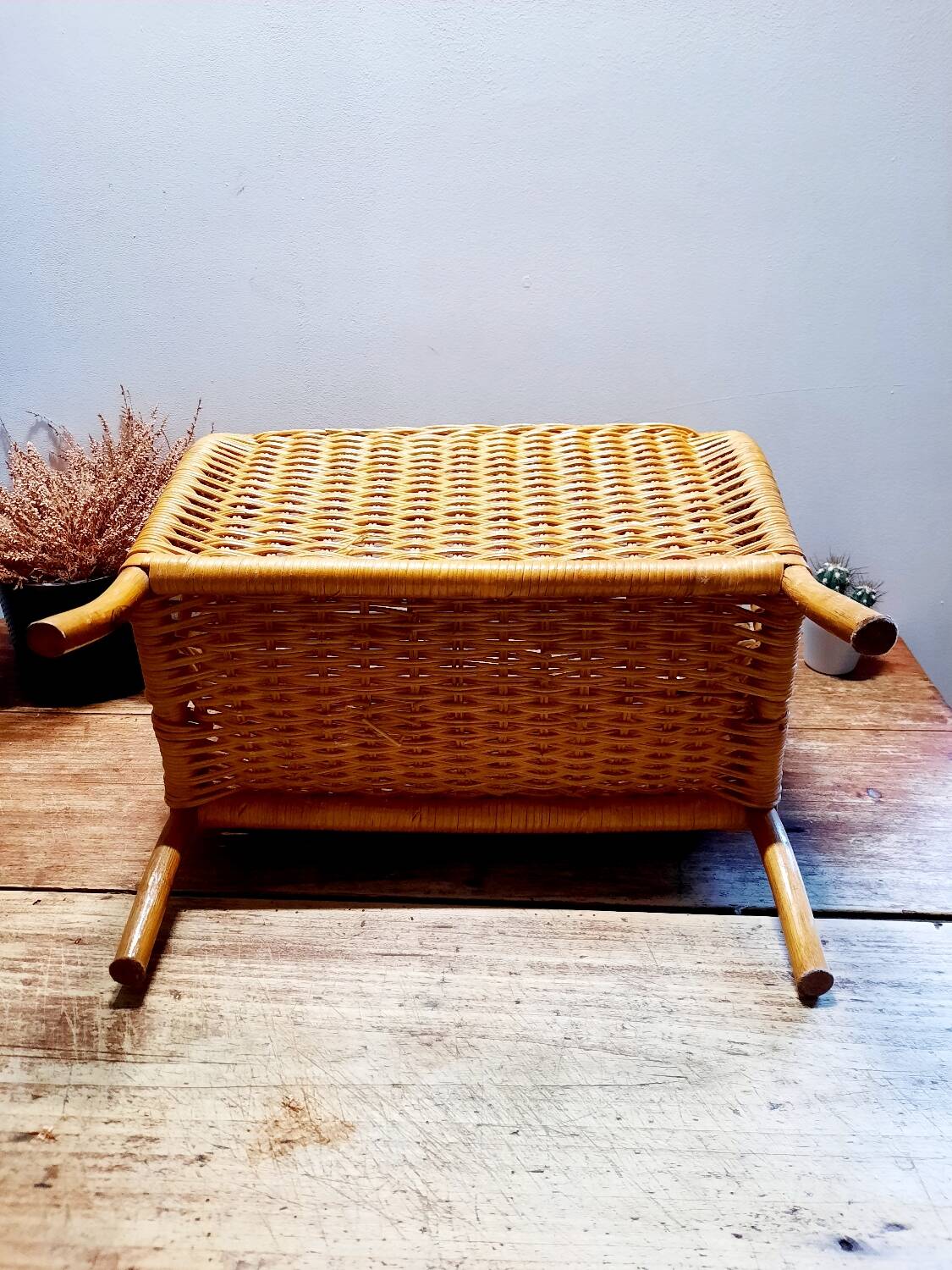 Antique rattan magazine rack
